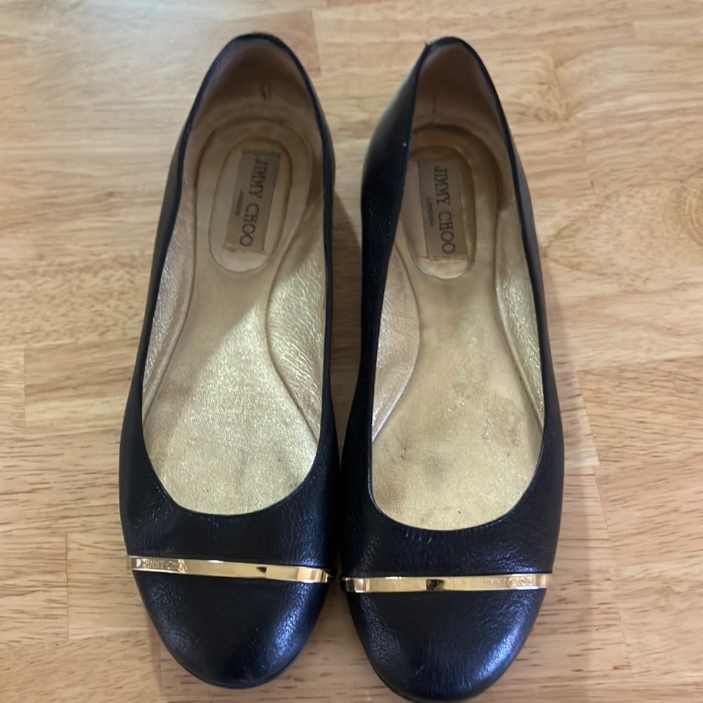 Jimmy Choo black flats with gold accent